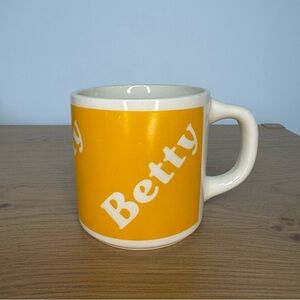 Vintage Yellow Ceramic Mug with 'Betty' Text AS IS